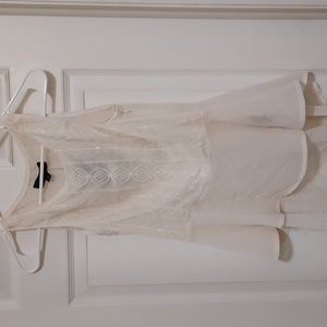 Cream colored lace front/sheer back sleeveless top